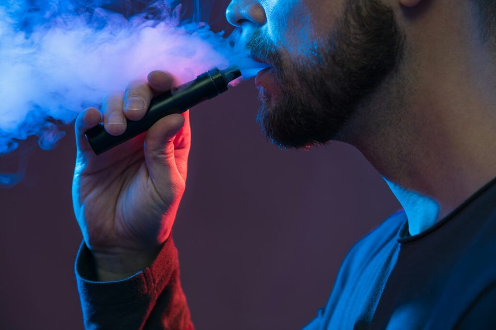 Vaping flavored e-liquid from an electronic cigarette